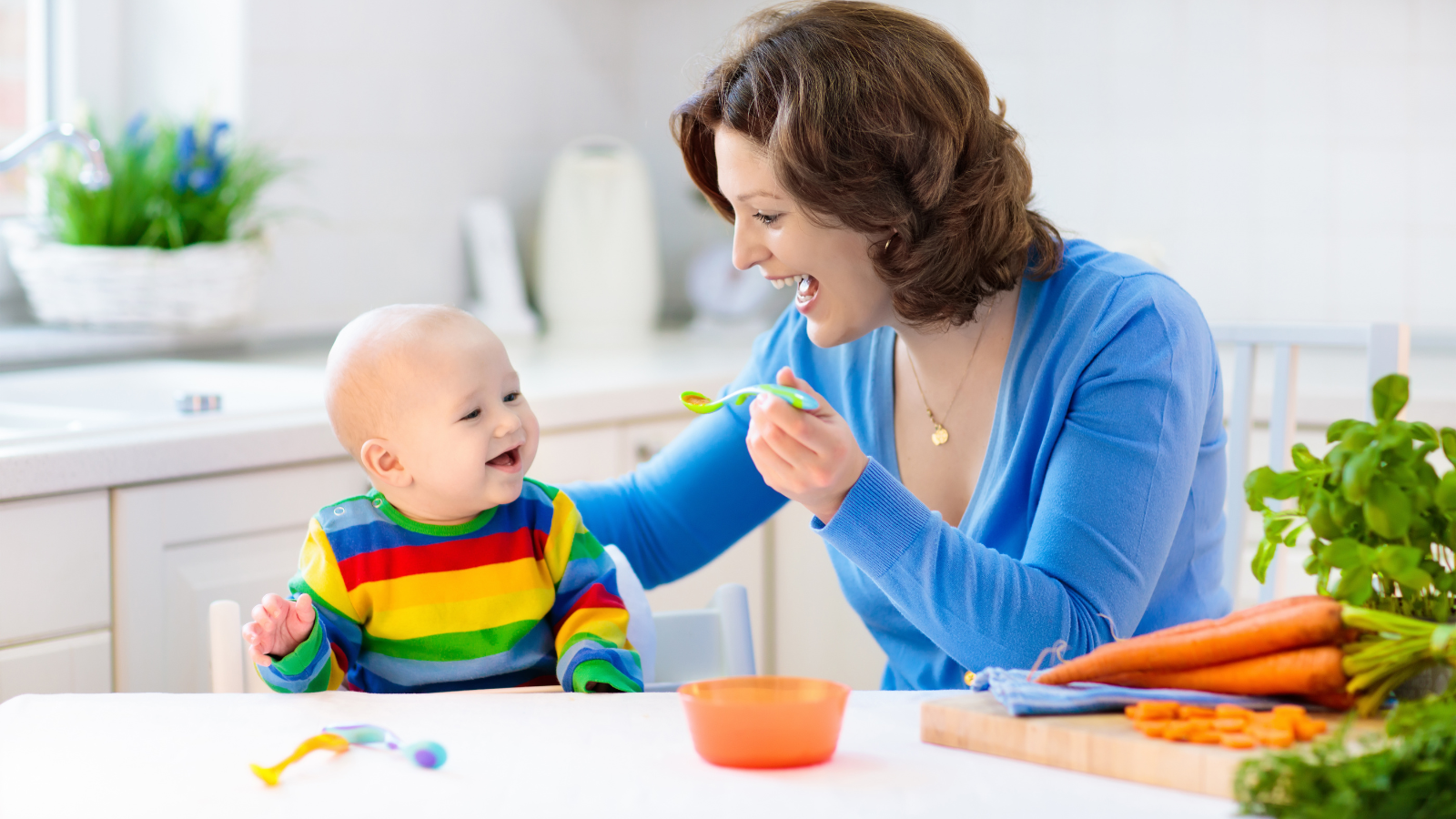 Mother feeding a boy