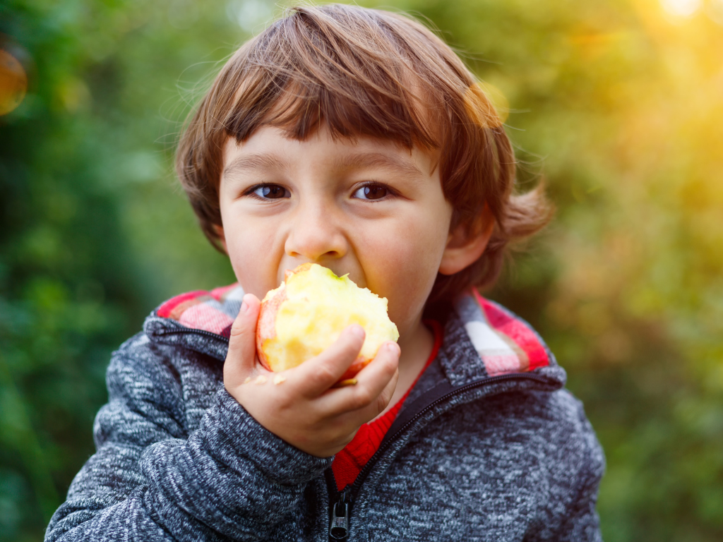 A boy eating fruit