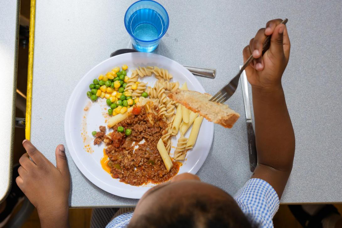 child eating school dinner, shot from above